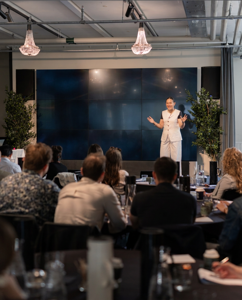 Jackie Luzy Hansen delivering a keynote on emotional branding to a live audience